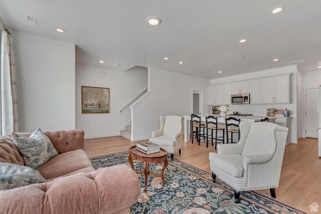 169 E Volunteer Dr, Spanish Fork, UT 84660 - living room with stairs, recessed lighting, and light wood-style floors