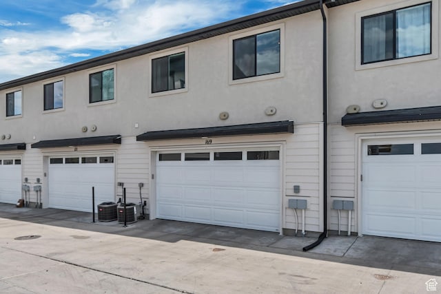 169 E Volunteer Dr, Spanish Fork, UT 84660 - back of property featuring a garage and stucco siding