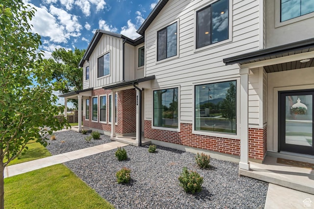 169 E Volunteer Dr, Spanish Fork, UT 84660 - view of property exterior with brick siding and board and batten siding