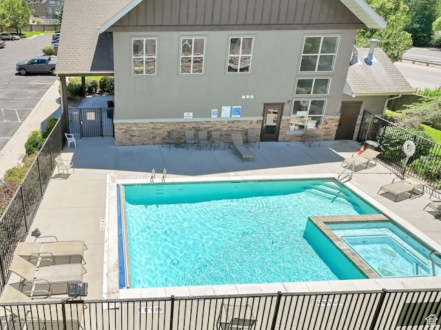 4988 S Timber Way E Unit 206, Millcreek, UT 84117 - view of pool featuring a patio area and a pool with connected hot tub