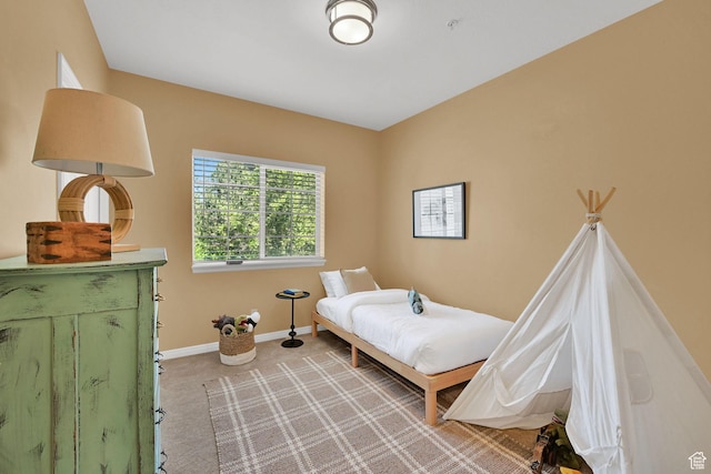 4988 S Timber Way E Unit 206, Millcreek, UT 84117 - bedroom featuring light carpet and baseboards