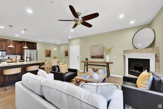 4988 S Timber Way E Unit 206, Millcreek, UT 84117 - living room featuring light tile patterned floors, a ceiling fan, recessed lighting, and a glass covered fireplace