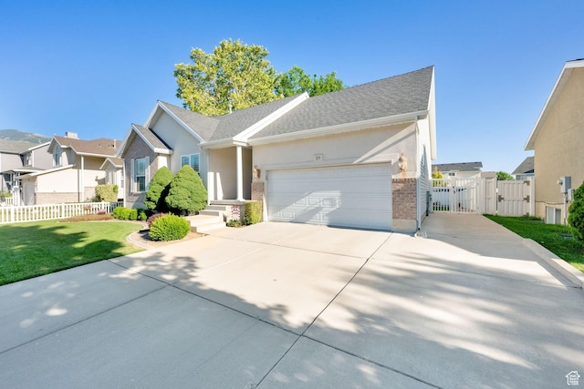 224 Rawlins Ln, Draper, UT 84020 - single story home with a gate, a residential view, concrete driveway, an attached garage, and brick siding