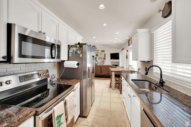224 Rawlins Ln, Draper, UT 84020 - kitchen featuring stainless steel appliances, white cabinetry, backsplash, recessed lighting, and light tile patterned floors