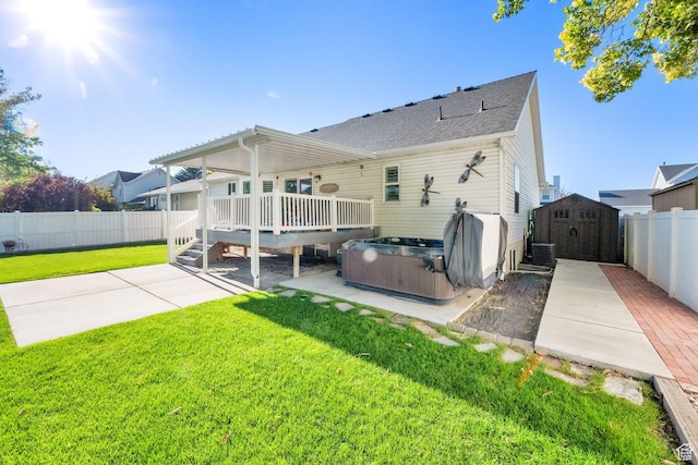 224 Rawlins Ln, Draper, UT 84020 - rear view of property with a hot tub, a storage shed, a deck, a fenced backyard, and a patio