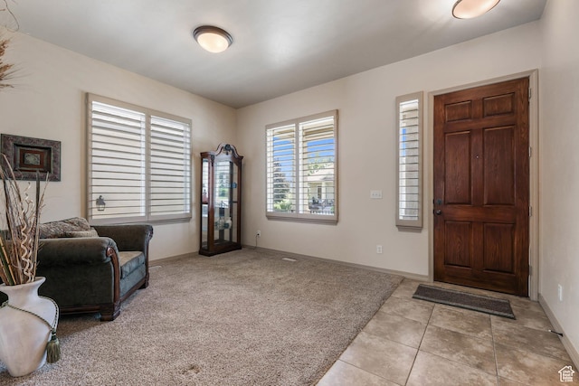 1524 W Foliage Ln, South Jordan, UT 84095 - foyer featuring light tile patterned floors and light carpet