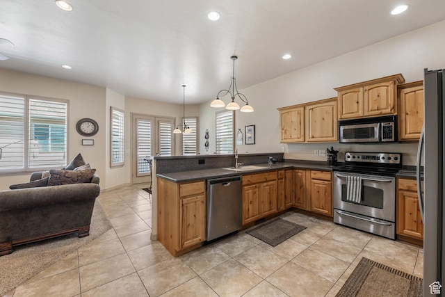 1524 W Foliage Ln, South Jordan, UT 84095 - kitchen featuring stainless steel appliances, open floor plan, dark countertops, a peninsula, and recessed lighting