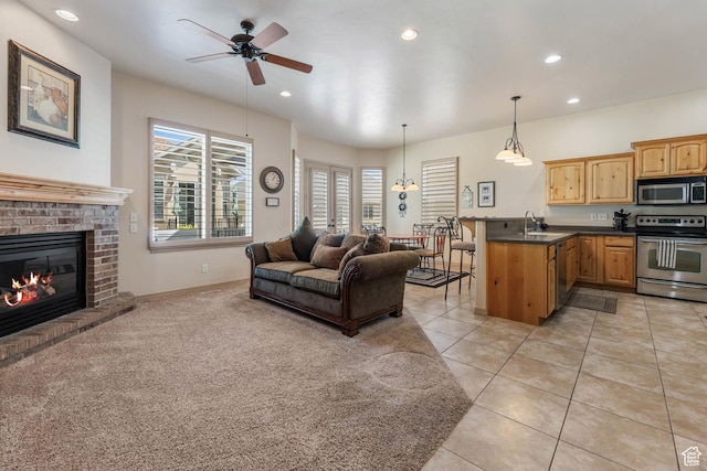 1524 W Foliage Ln, South Jordan, UT 84095 - living area with ceiling fan, recessed lighting, a brick fireplace, and light tile patterned flooring