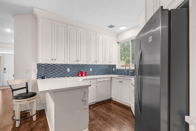 9566 N 4500 W, Cedar Hills, UT 84062 - kitchen with stainless steel refrigerator with ice dispenser, dishwasher, a peninsula, tasteful backsplash, and white cabinetry