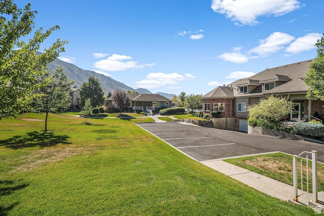 9566 N 4500 W, Cedar Hills, UT 84062 - view of home's community featuring a residential view, uncovered parking, a lawn, and a mountain view