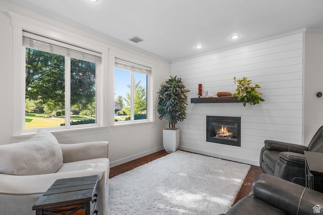 9566 N 4500 W, Cedar Hills, UT 84062 - living area featuring healthy amount of natural light, ornamental molding, a glass covered fireplace, recessed lighting, and wood finished floors
