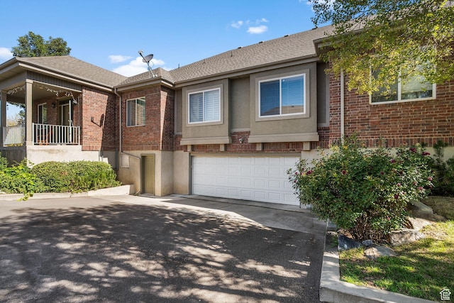 9566 N 4500 W, Cedar Hills, UT 84062 - view of front facade with brick siding, a garage, driveway, and a shingled roof