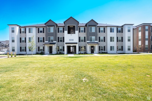 3722 W 1440 N Unit F202, Lehi, UT 84043 - view of front of property with a front yard and stucco siding