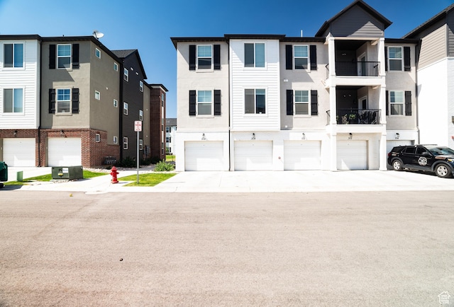 3722 W 1440 N Unit F202, Lehi, UT 84043 - traditional-style house with stucco siding, a garage, and driveway
