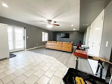 3462 Heyward Ct, Eagle Mountain, UT 84043 - tiled living area with ceiling fan and recessed lighting