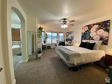 3462 Heyward Ct, Eagle Mountain, UT 84043 - carpeted bedroom featuring arched walkways and ceiling fan