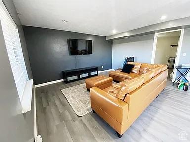 3462 Heyward Ct, Eagle Mountain, UT 84043 - living room featuring wood finished floors and recessed lighting