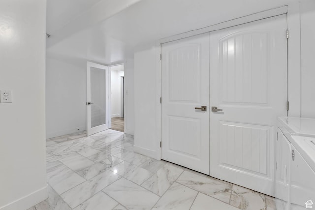 1692 N Sage Ln, Saratoga Springs, UT 84045 - below grade area with independent washer and dryer and light marble finish floors