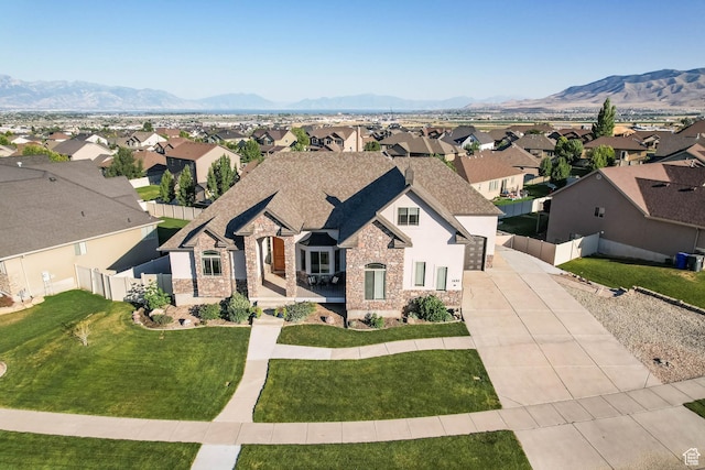 1692 N Sage Ln, Saratoga Springs, UT 84045 - french provincial home featuring concrete driveway, a residential view, and a mountain view
