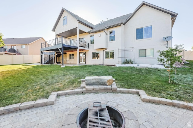 1692 N Sage Ln, Saratoga Springs, UT 84045 - rear view of house with a patio area, stucco siding, and a fire pit