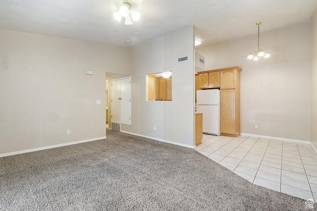 1330 W 1480 N, Orem, UT 84057 - empty room with vaulted ceiling, a chandelier, light colored carpet, and light tile patterned floors