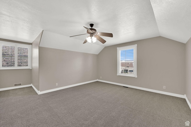 3112 N Pelican Dr, Farr West, UT 84404 - bonus room featuring lofted ceiling, a ceiling fan, carpet floors, and a textured ceiling