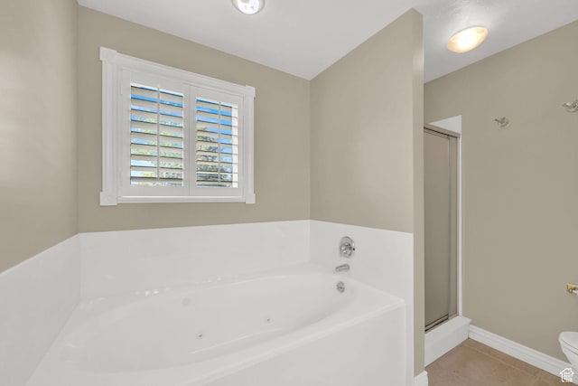 3112 N Pelican Dr, Farr West, UT 84404 - full bathroom featuring a garden tub, tile patterned flooring, and a shower stall