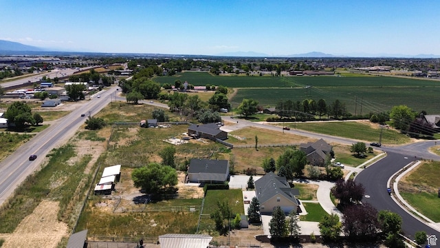 3112 N Pelican Dr, Farr West, UT 84404 - aerial view of property's location with a mountainous background and rural landscape