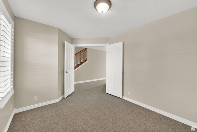 3112 N Pelican Dr, Farr West, UT 84404 - carpeted empty room featuring baseboards