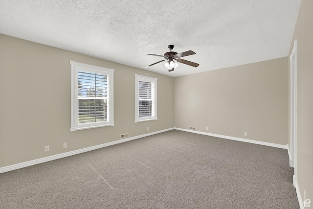 3112 N Pelican Dr, Farr West, UT 84404 - spare room featuring a textured ceiling, ceiling fan, and carpet