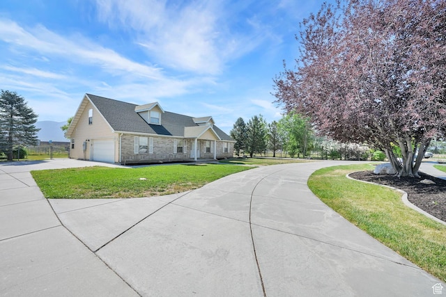 3112 N Pelican Dr, Farr West, UT 84404 - view of front of home featuring concrete driveway, a front lawn, stone siding, and an attached garage