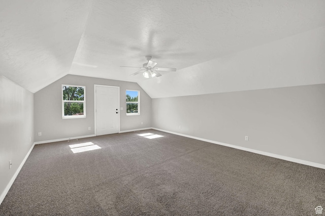 3112 N Pelican Dr, Farr West, UT 84404 - additional living space with ceiling fan, dark carpet, and lofted ceiling