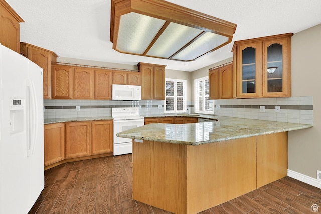 3112 N Pelican Dr, Farr West, UT 84404 - kitchen with white appliances, a peninsula, glass insert cabinets, and light stone countertops