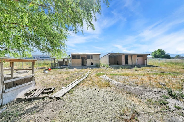 3112 N Pelican Dr, Farr West, UT 84404 - rear view of house featuring an exterior structure and an outdoor structure