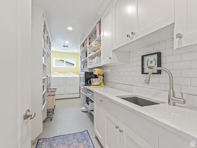 2677 N 700 E, Provo, UT 84604 - kitchen featuring washing machine and dryer, open shelves, white cabinets, backsplash, and recessed lighting