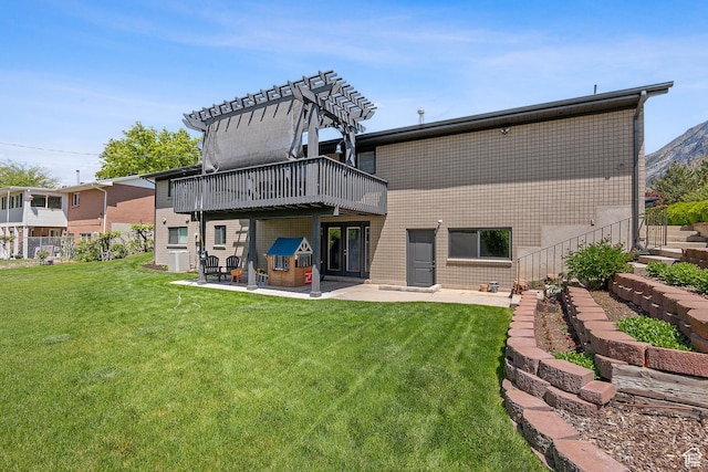 2677 N 700 E, Provo, UT 84604 - back of house featuring a yard, a patio, a wooden deck, and brick siding