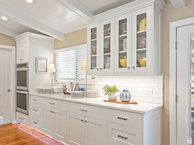 2677 N 700 E, Provo, UT 84604 - kitchen with double oven, beam ceiling, tasteful backsplash, white cabinets, and glass insert cabinets