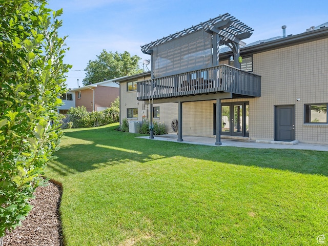 2677 N 700 E, Provo, UT 84604 - back of property featuring a lawn, a wooden deck, french doors, and a patio