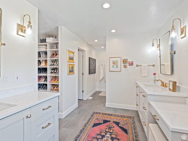 2677 N 700 E, Provo, UT 84604 - full bathroom featuring two vanities, tile patterned flooring, recessed lighting, and a textured ceiling