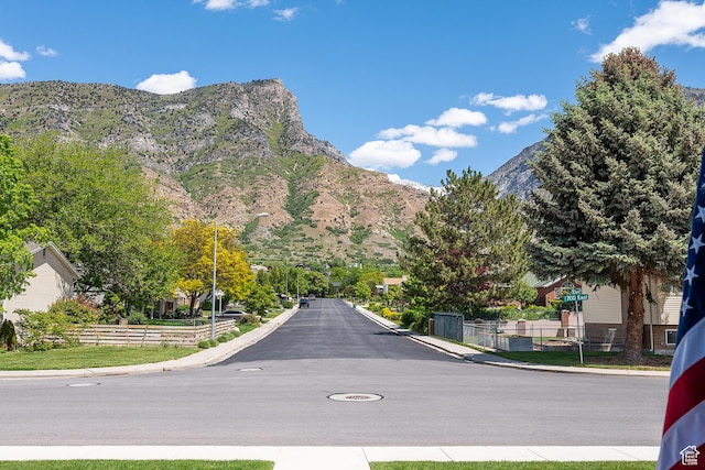 2677 N 700 E, Provo, UT 84604 - view of asphalt street featuring a mountain view, curbs, sidewalks, and street lighting