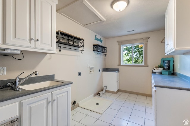 6373 W 10500 N, Highland, UT 84003 - laundry room featuring hookup for an electric dryer, cabinet space, hookup for a washing machine, and light tile patterned flooring