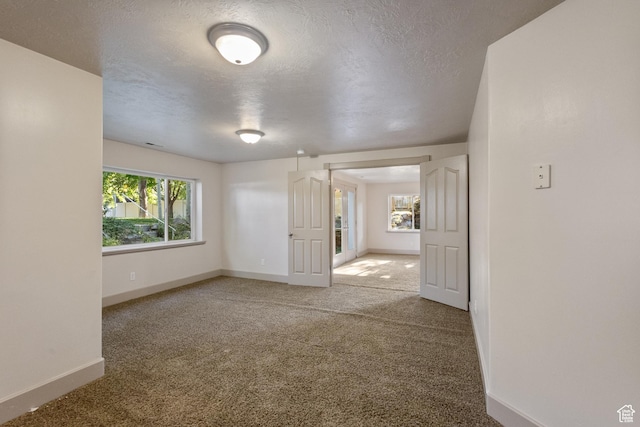 6373 W 10500 N, Highland, UT 84003 - spare room with carpet and a textured ceiling