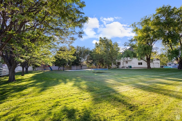6373 W 10500 N, Highland, UT 84003 - view of grassy yard with a trampoline