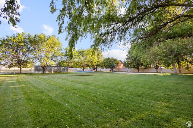 6373 W 10500 N, Highland, UT 84003 - fenced backyard with a trampoline