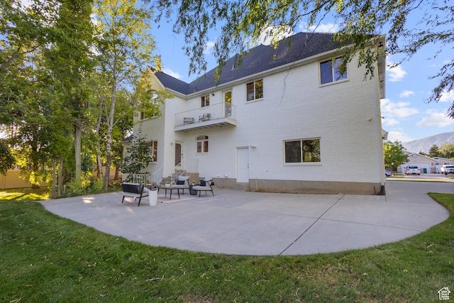 6373 W 10500 N, Highland, UT 84003 - rear view of property with a balcony, a patio, a lawn, and entry steps