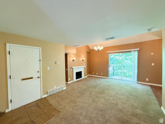 165 E 100 N Unit F, Logan, UT 84321 - unfurnished living room featuring a chandelier, carpet, and a fireplace