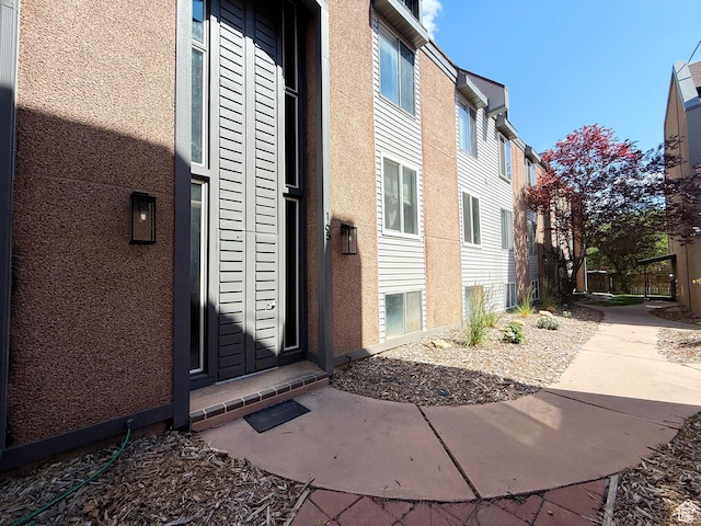165 E 100 N Unit F, Logan, UT 84321 - doorway to property with stucco siding