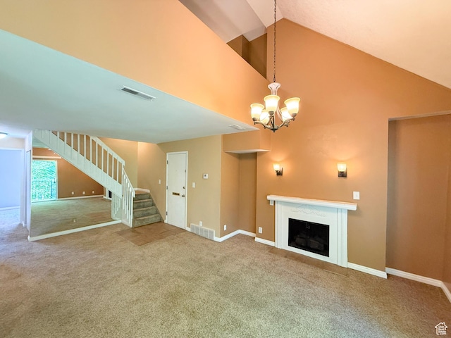 165 E 100 N Unit F, Logan, UT 84321 - unfurnished living room with carpet, stairway, a fireplace, a chandelier, and high vaulted ceiling