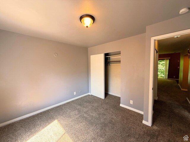 165 E 100 N Unit F, Logan, UT 84321 - unfurnished bedroom featuring dark colored carpet and a closet