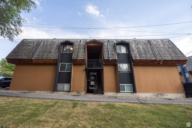 240 E 400 N Unit 28, Logan, UT 84321 - view of front of house with a front lawn, mansard roof, and stairs